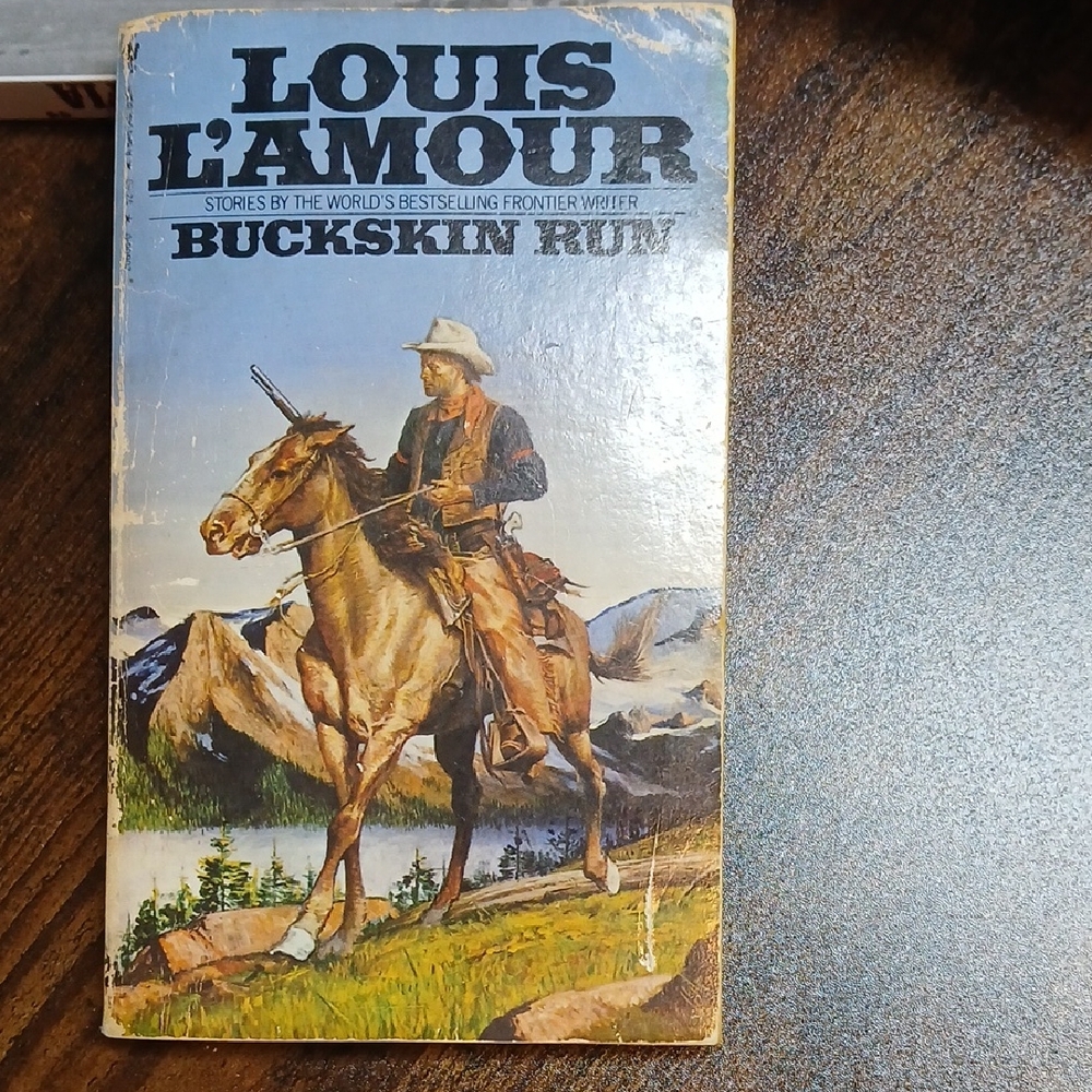 Louis L'Amour Buckskin Run Paperback - Cowboy Illustration, Blue & Brown